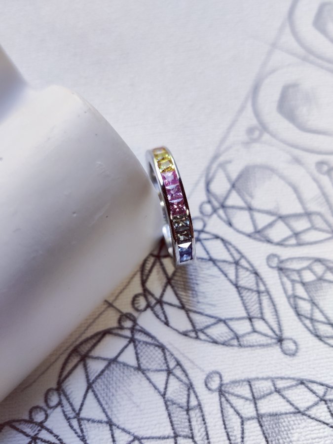 Multi colour channel set sapphire ring